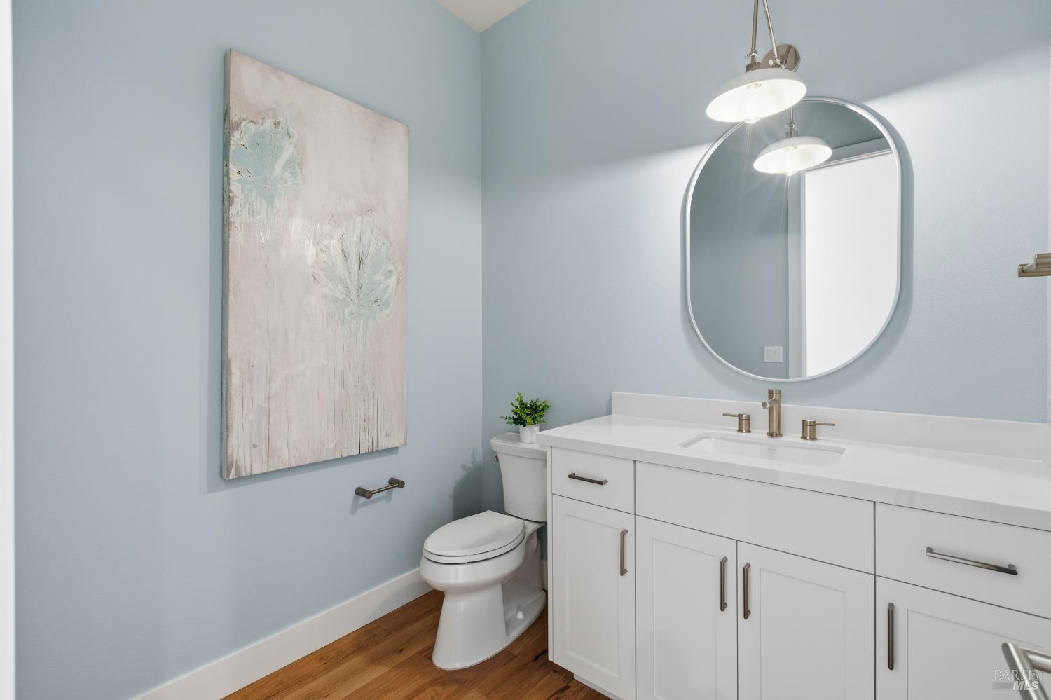 3945 Parker Hill Road Santa Rosa, CA 95404 - Photo 25 of 53 a bathroom with a toilet sink and mirror