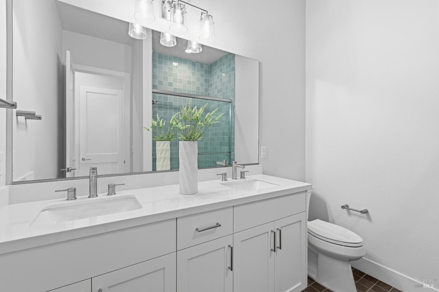 3945 Parker Hill Road Santa Rosa, CA 95404 - Photo 29 of 53 a bathroom with a toilet sink and mirror