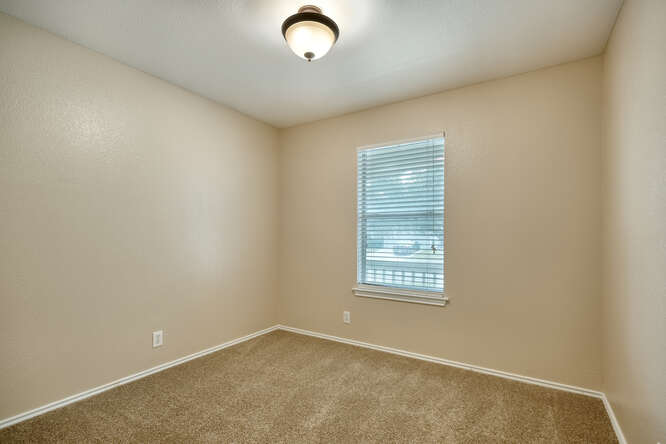 244 Langely Kyle, TX 78640 - Photo 9 of 15 Carpeted spare room featuring baseboards
