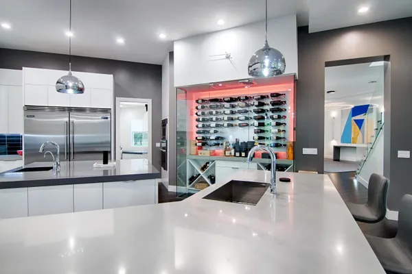 a spacious bathroom with a double vanity sink a large mirror and a bathtub