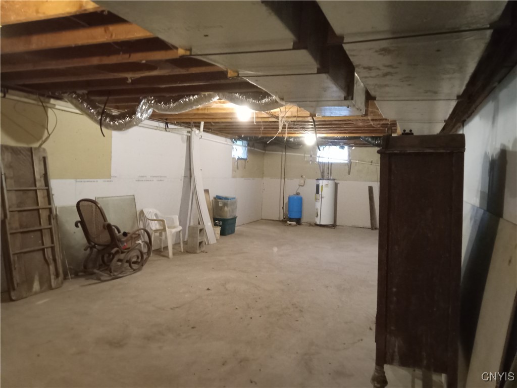 11589 Ferris Road Ira, NY 13033 - Photo 15 of 24 Basement other side looking at hot water tank