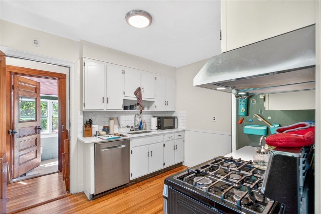 76-78 Lewis Road Belmont, MA 02478 - Photo 3 of 36 a kitchen with a stove and a refrigerator