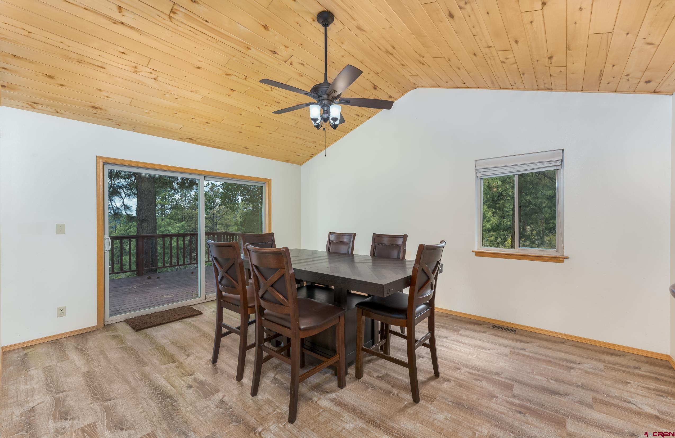 197 Buckhorn Road Bayfield, CO 81122 - Photo 5 of 34 a view of a dining room with furniture window and wooden floor