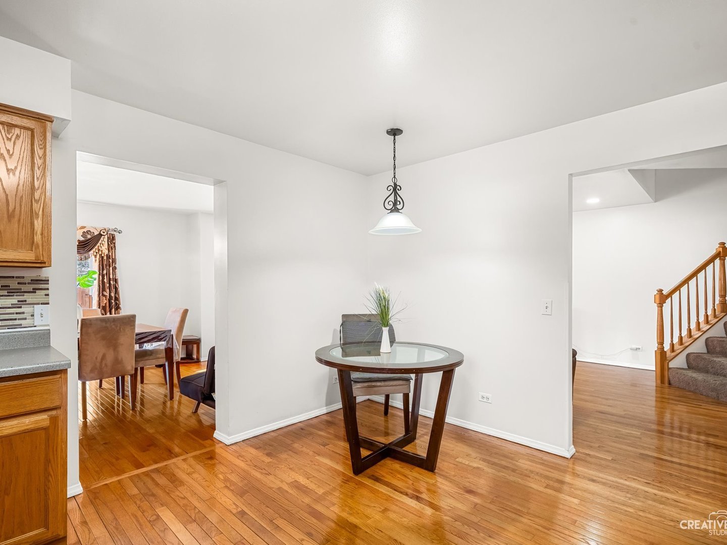 301 Inner Cir Drive Bolingbrook, IL 60490 - Photo 9 of 20 a view of a dining room with furniture and wooden floor
