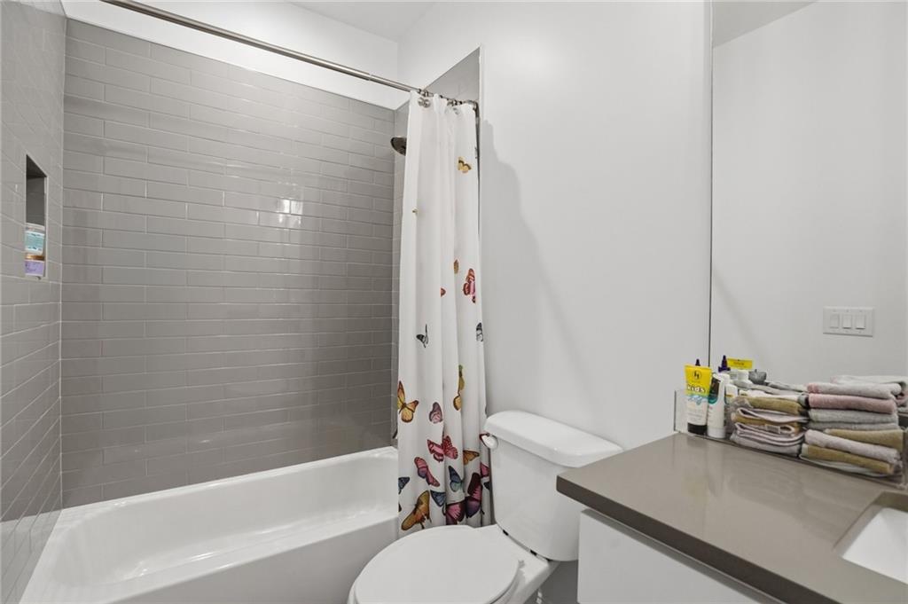 3020 Wallace Road Buford, GA 30519 - Photo 42 of 66 a bathroom with a sink toilet and shower