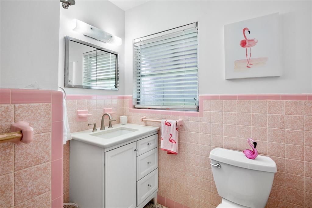223 Roberts Road Nokomis, FL 34275 - Photo 17 of 27 a bathroom with a sink and a mirror