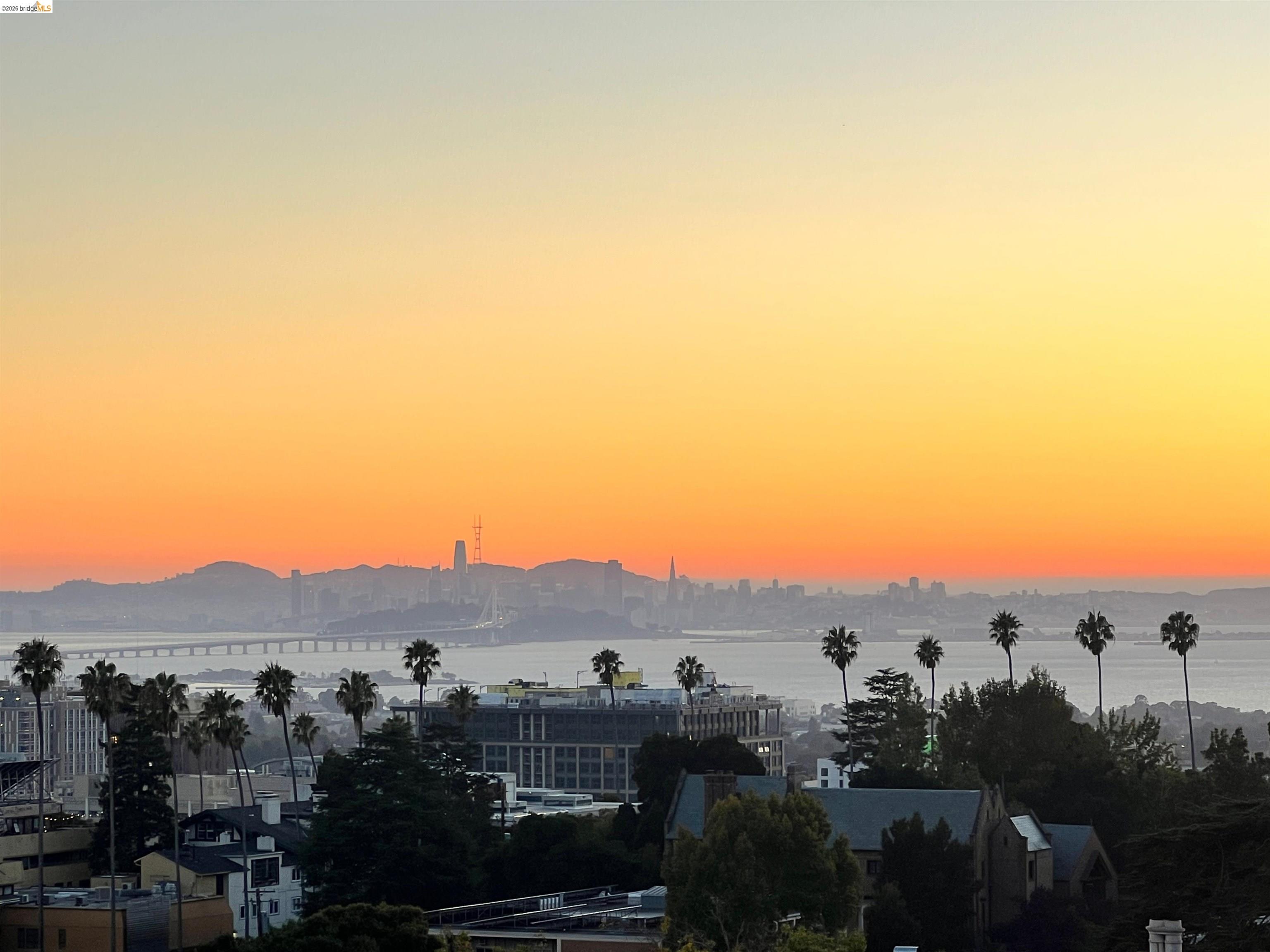 View of mountain backdrop featuring a nearby body of water