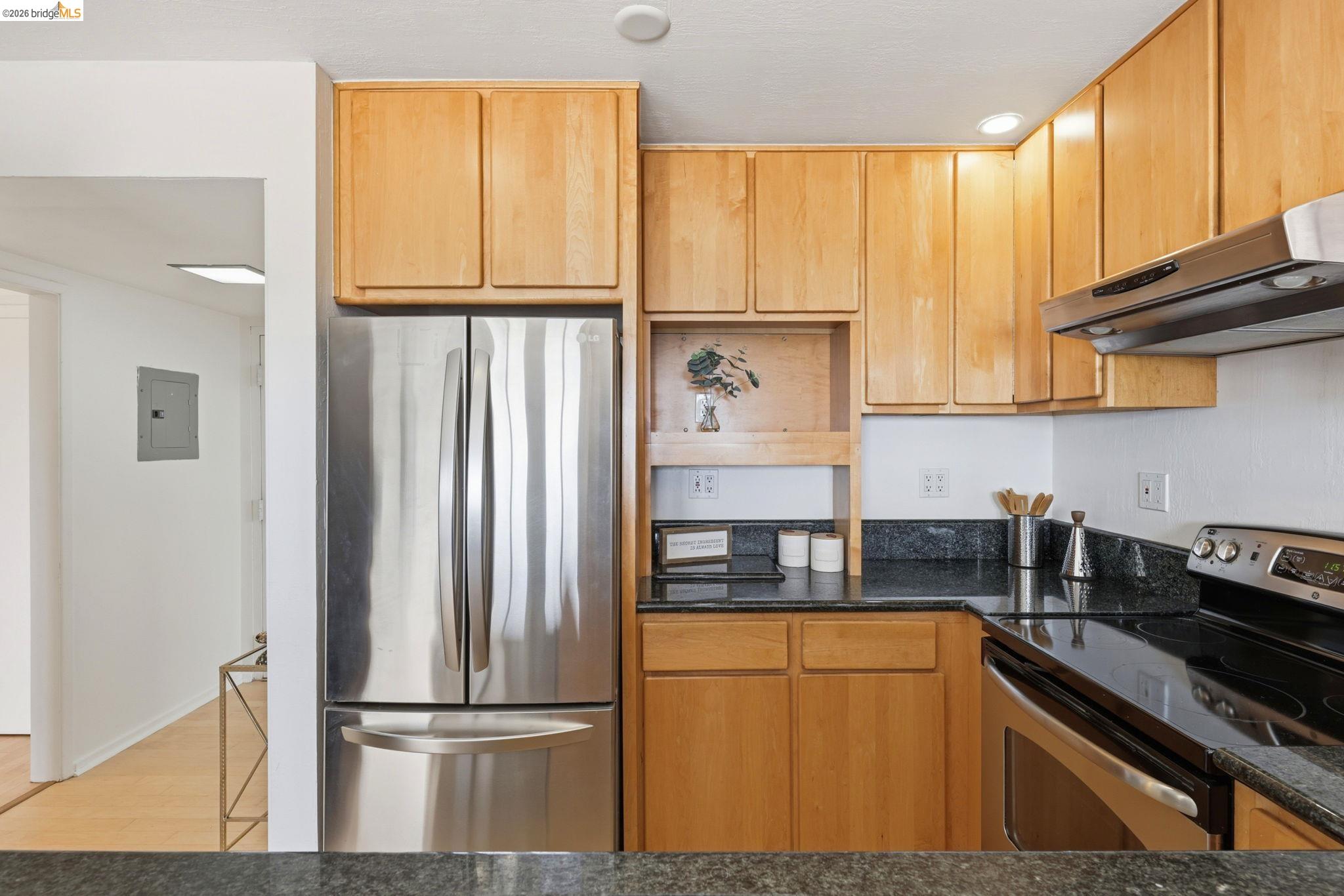 2634 Virginia Street, Unit 33 Berkeley, CA 94709 - Photo 13 of 31 a kitchen with stainless steel appliances granite countertop a refrigerator and a sink