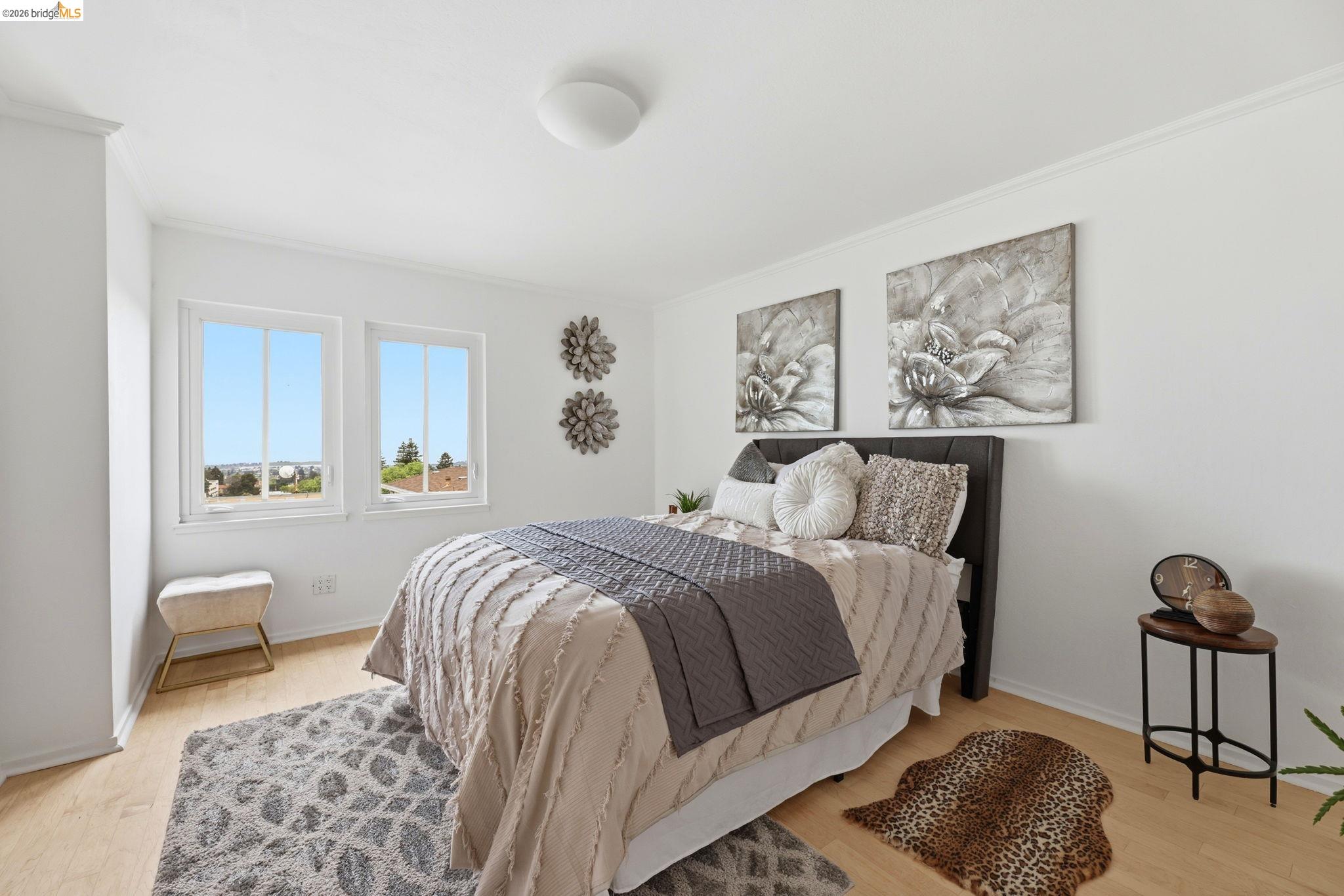 2634 Virginia Street, Unit 33 Berkeley, CA 94709 - Photo 14 of 31 a bedroom with a bed and a painting on the wall