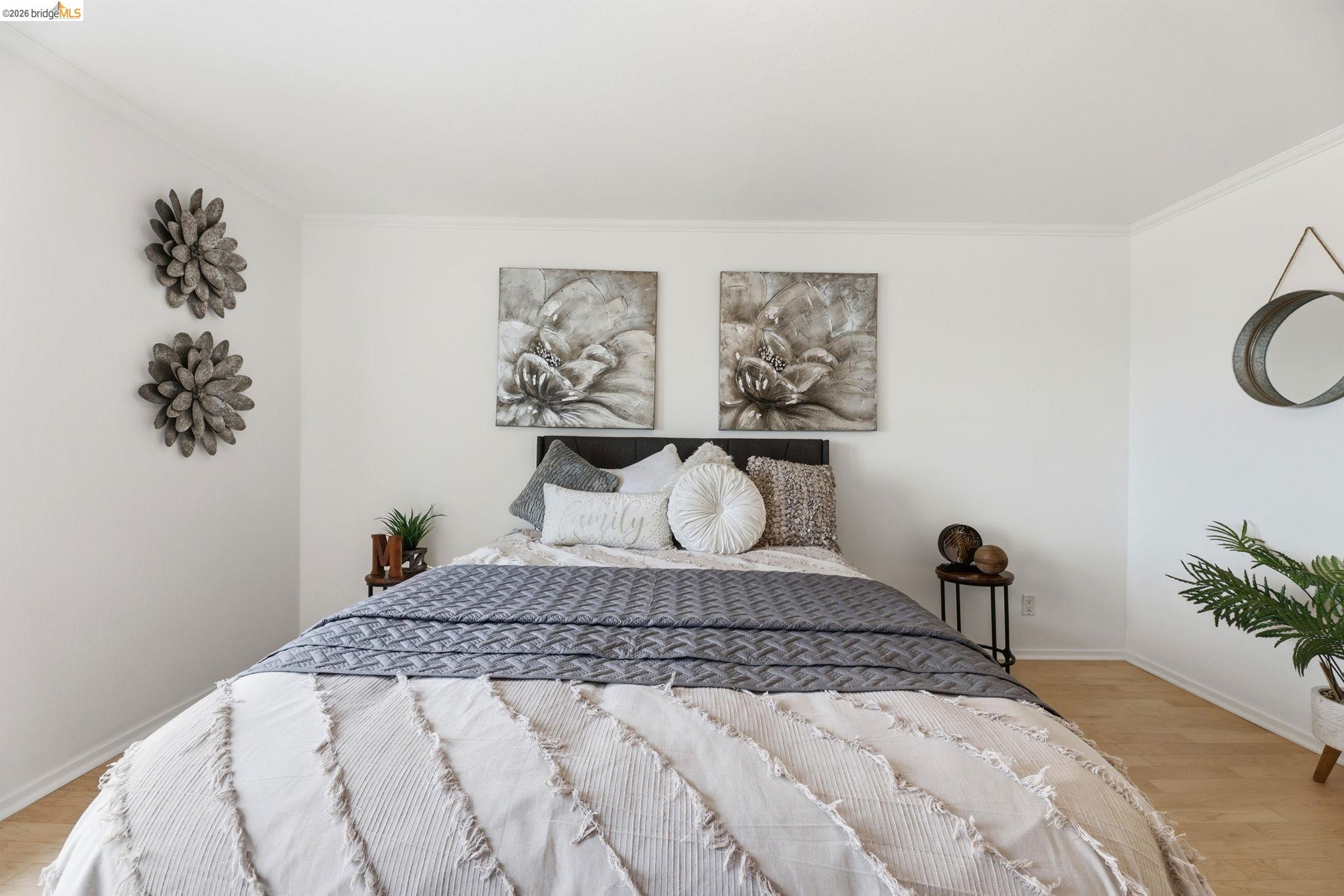 2634 Virginia Street, Unit 33 Berkeley, CA 94709 - Photo 15 of 31 a bedroom with a bed and a potted plant