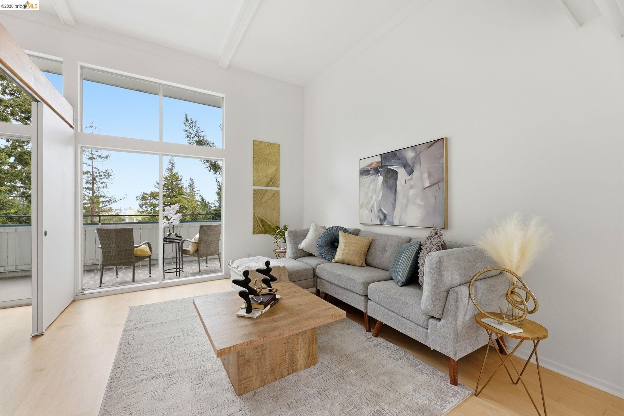 2634 Virginia Street, Unit 33 Berkeley, CA 94709 - Photo 2 of 31 a living room with furniture and a large window