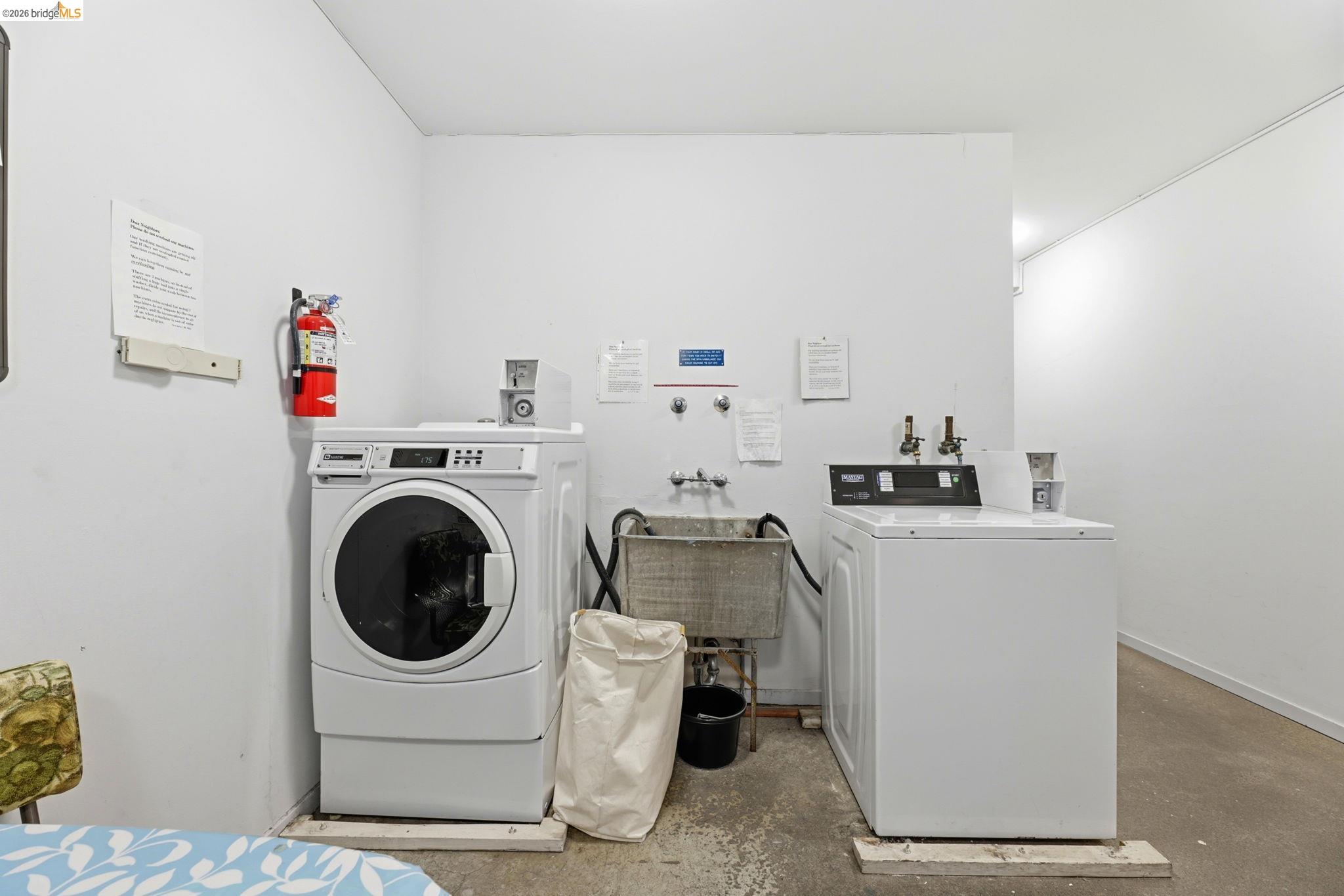 2634 Virginia Street, Unit 33 Berkeley, CA 94709 - Photo 29 of 31 a utility room with sink dryer and washer