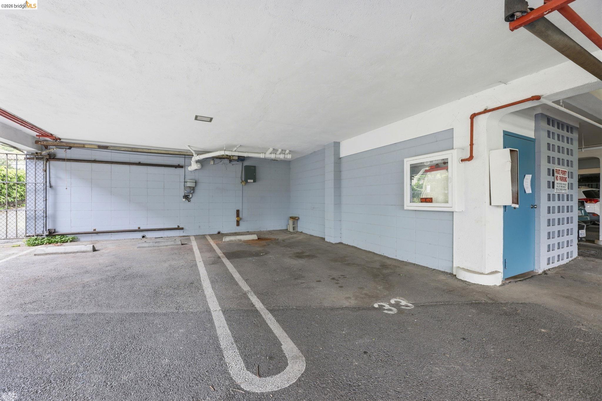 2634 Virginia Street, Unit 33 Berkeley, CA 94709 - Photo 30 of 31 Garage featuring a parking garage