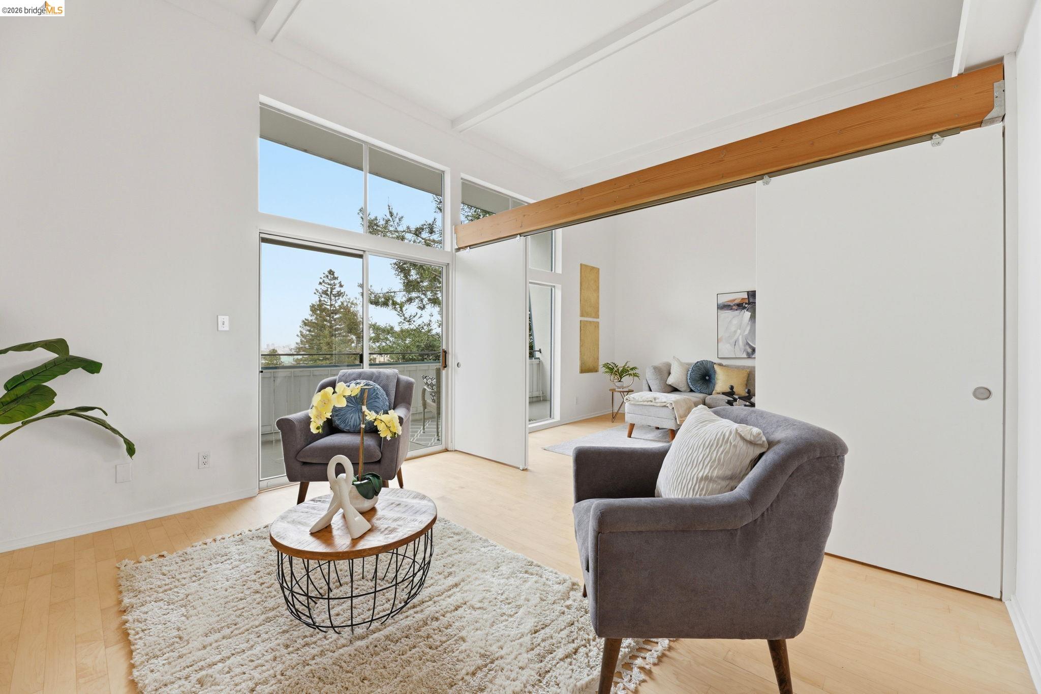 2634 Virginia Street, Unit 33 Berkeley, CA 94709 - Photo 3 of 31 a living room with furniture and a potted plant