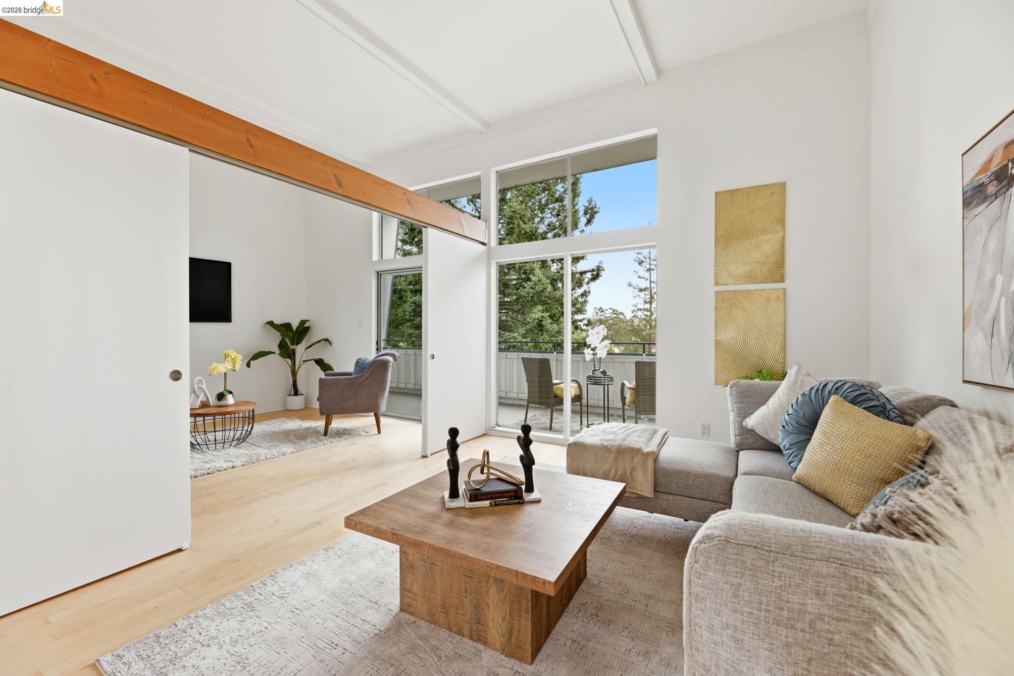 2634 Virginia Street, Unit 33 Berkeley, CA 94709 - Photo 4 of 31 a living room with furniture and a large window