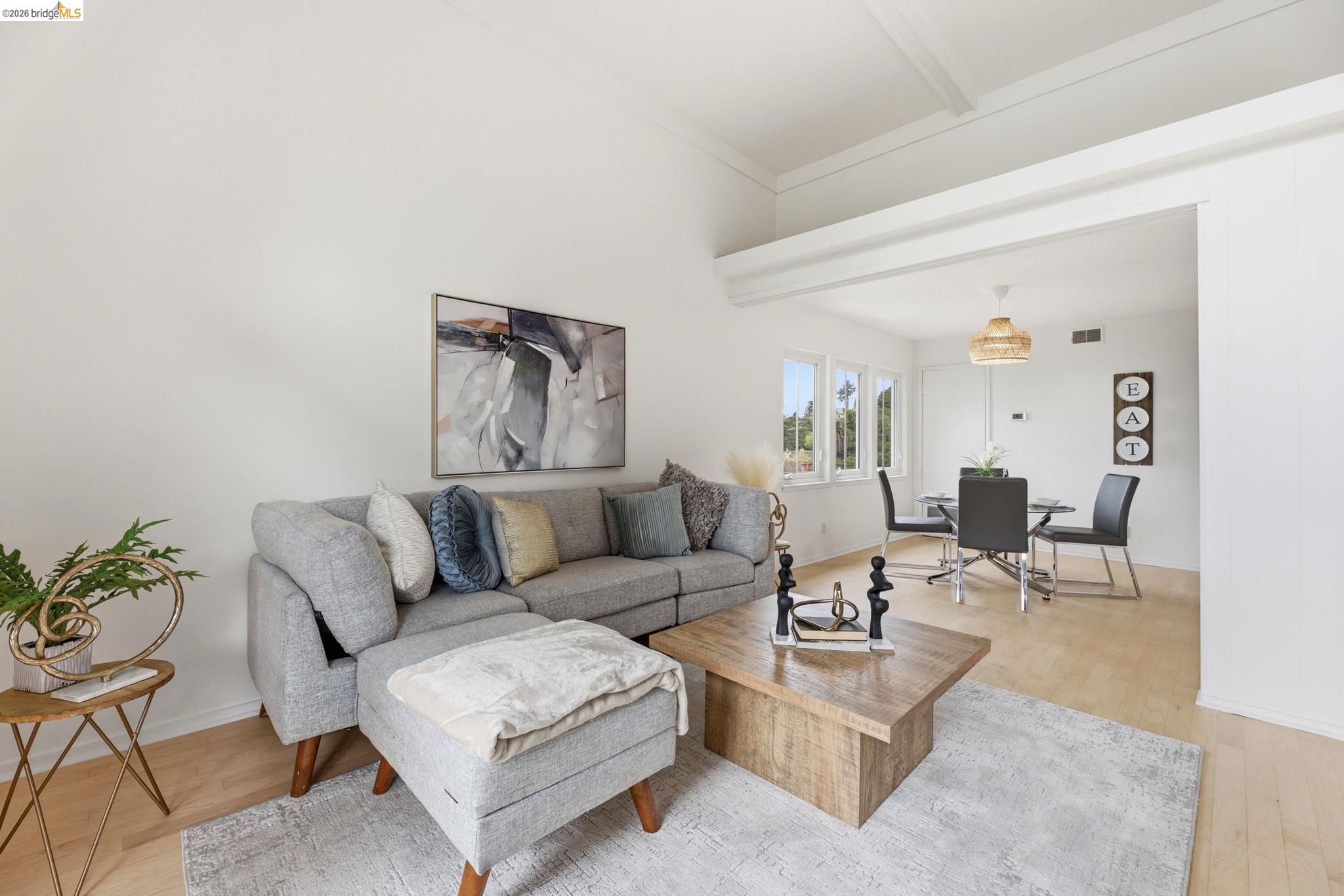 2634 Virginia Street, Unit 33 Berkeley, CA 94709 - Photo 6 of 31 a living room with furniture and wooden floor