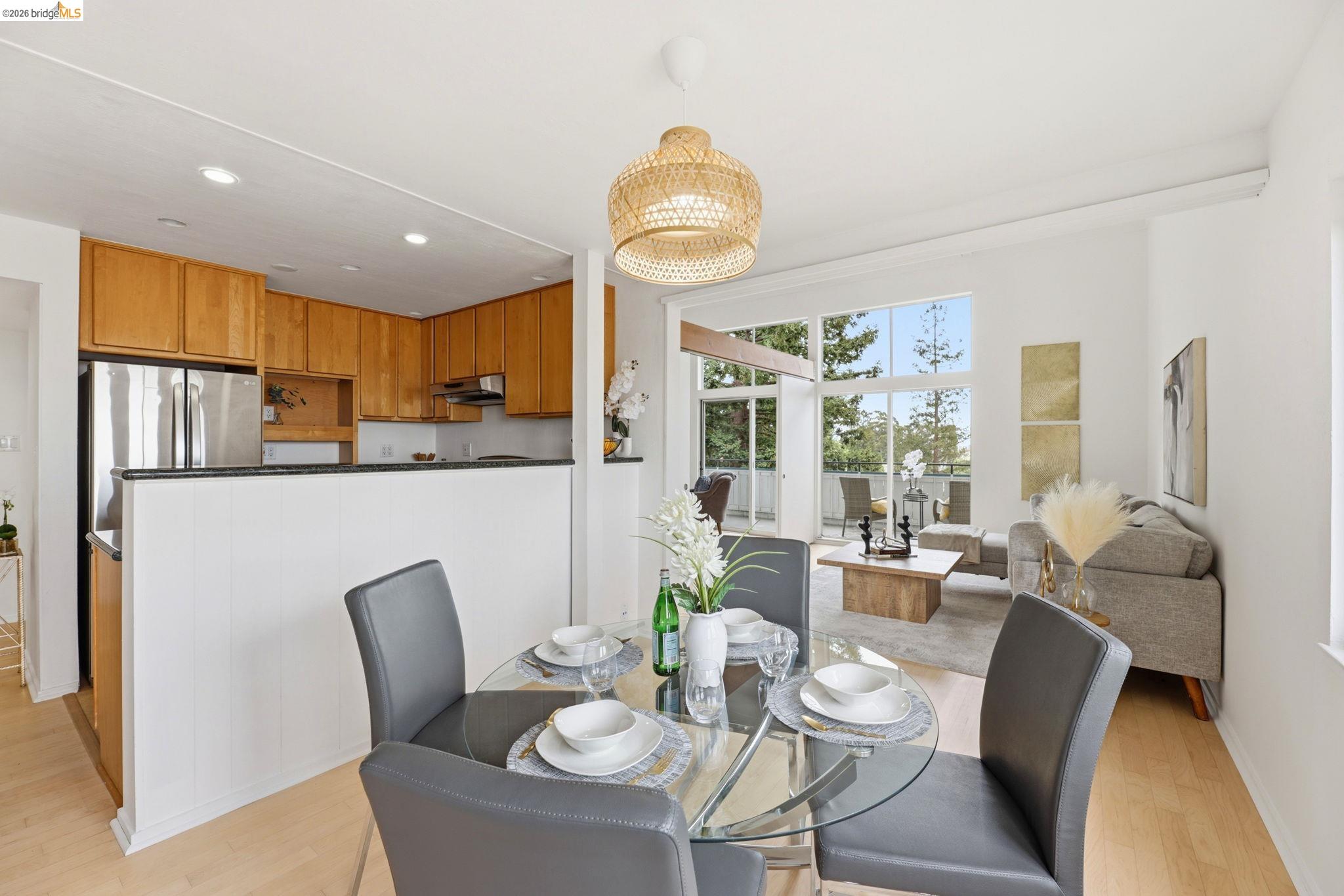 2634 Virginia Street, Unit 33 Berkeley, CA 94709 - Photo 10 of 31 a dining room with furniture a window and kitchen view