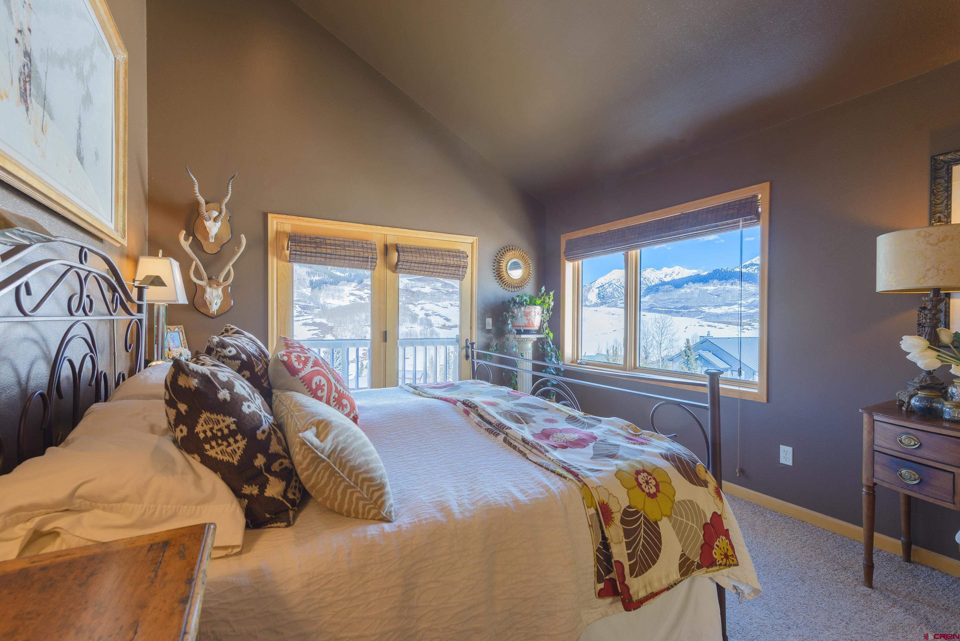 14 Ruby Drive Crested Butte, CO 81225 - Photo 17 of 44 a bedroom with a bed and a window