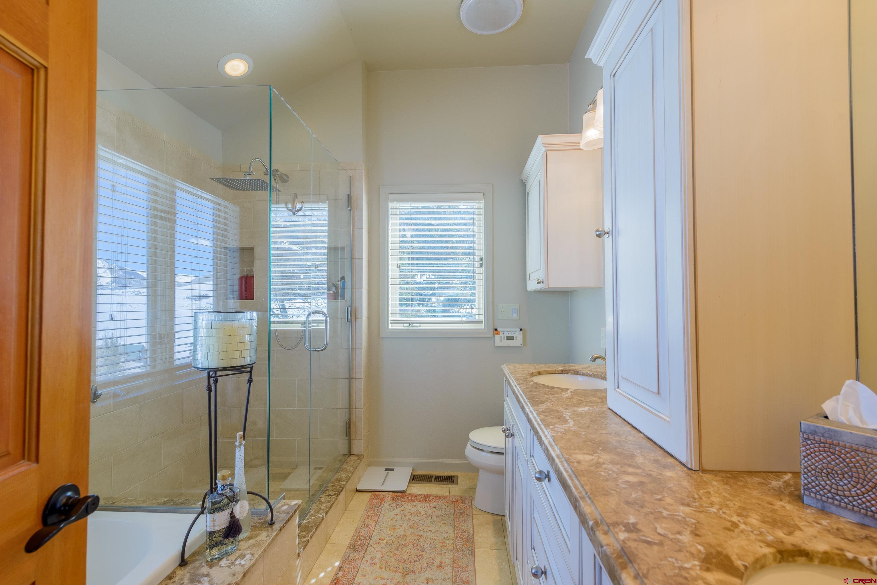 14 Ruby Drive Crested Butte, CO 81225 - Photo 21 of 44 a bathroom with a tub sink and mirror