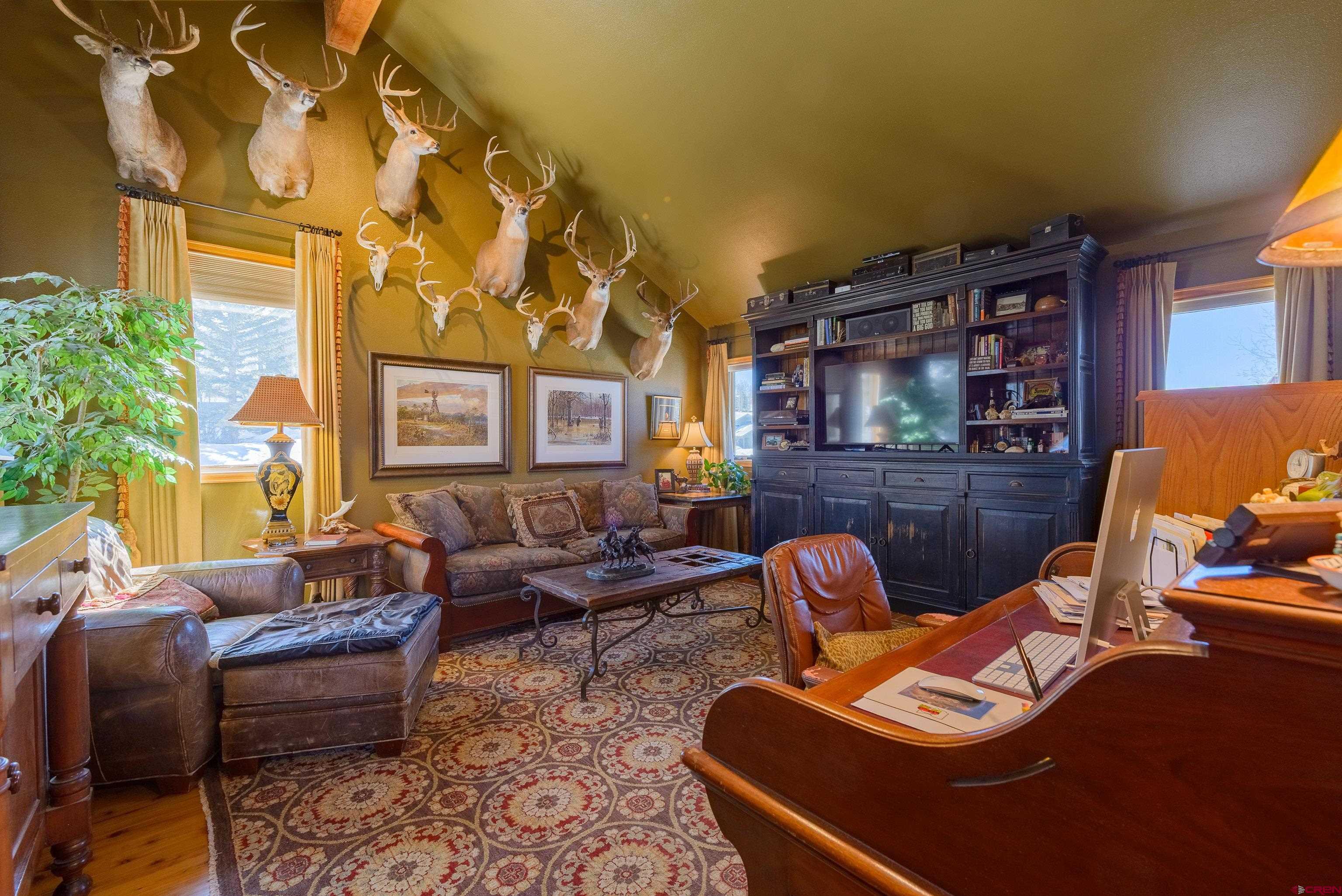14 Ruby Drive Crested Butte, CO 81225 - Photo 23 of 44 a living room with furniture fireplace and a large window