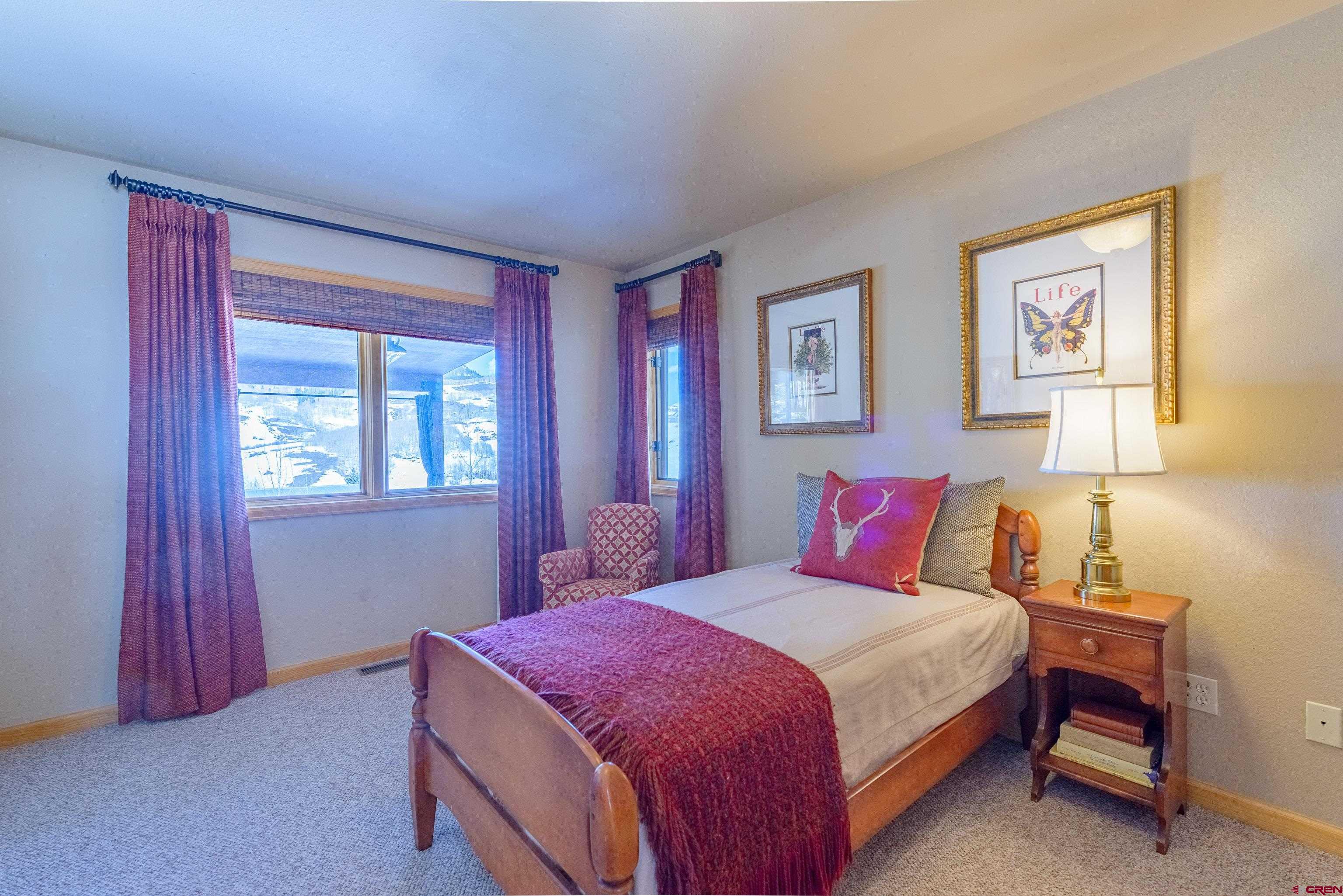 14 Ruby Drive Crested Butte, CO 81225 - Photo 29 of 44 a bedroom with a bed and a window