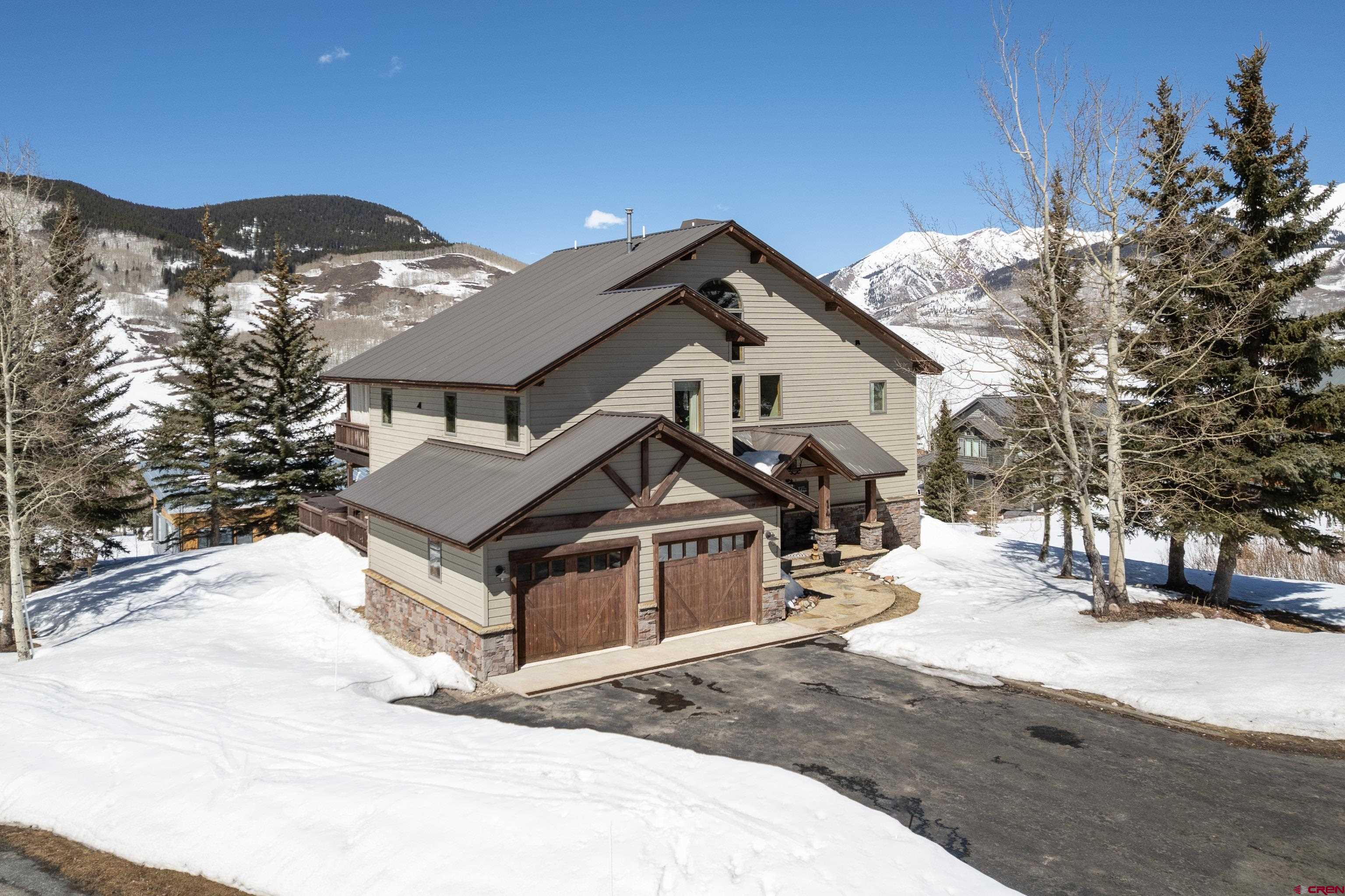 14 Ruby Drive Crested Butte, CO 81225 - Photo 4 of 44 a view of a house with a snow in the background