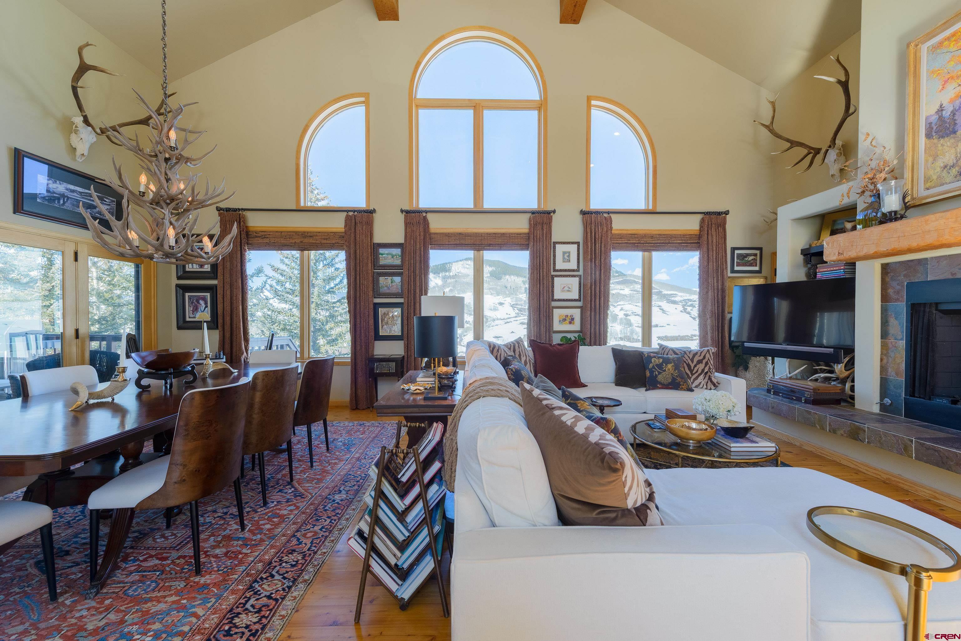 14 Ruby Drive Crested Butte, CO 81225 - Photo 8 of 44 a living room with furniture fireplace and a large window