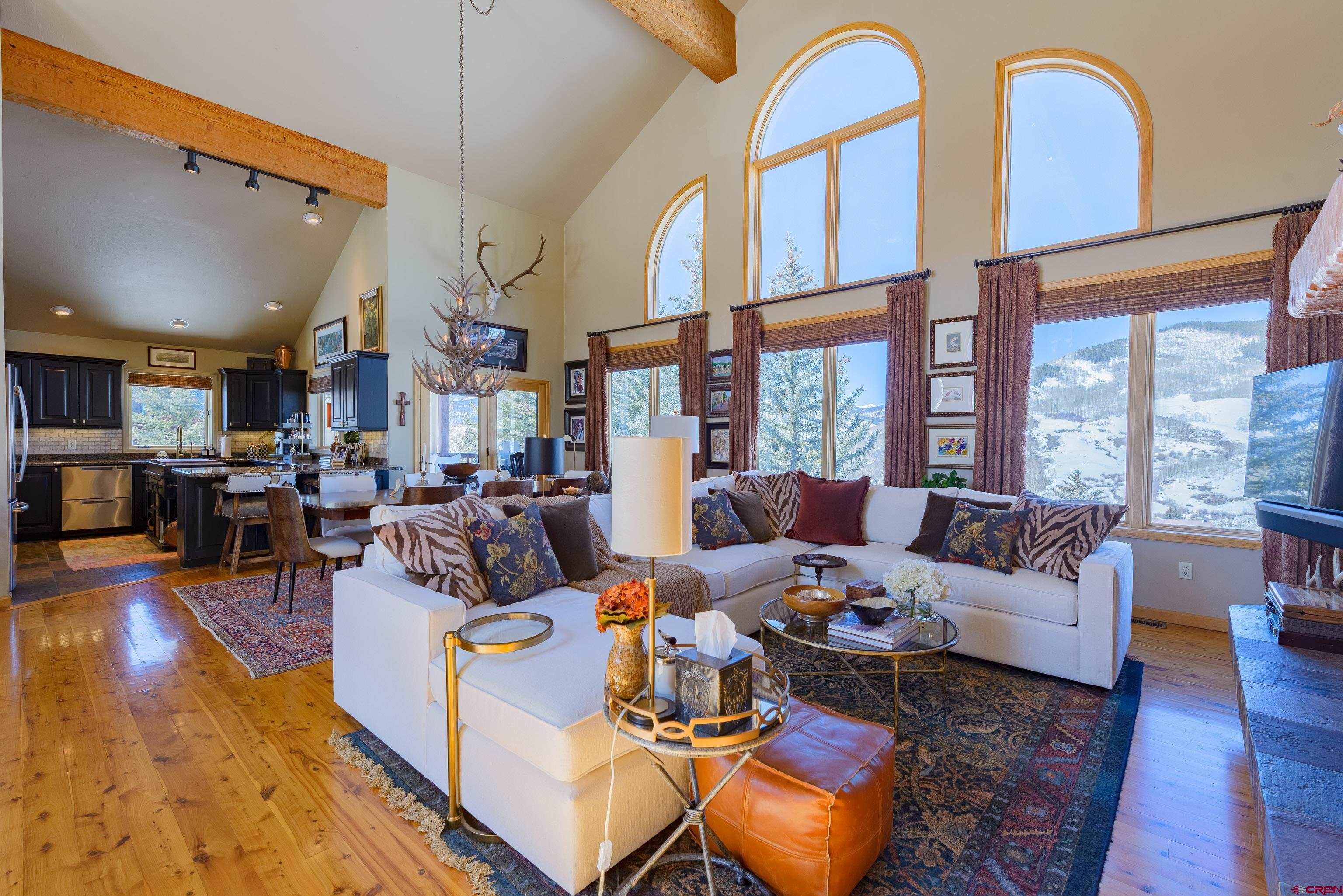 14 Ruby Drive Crested Butte, CO 81225 - Photo 9 of 44 a living room with furniture fireplace and a large window