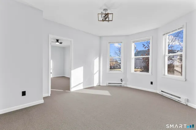 a view of an empty room with a window