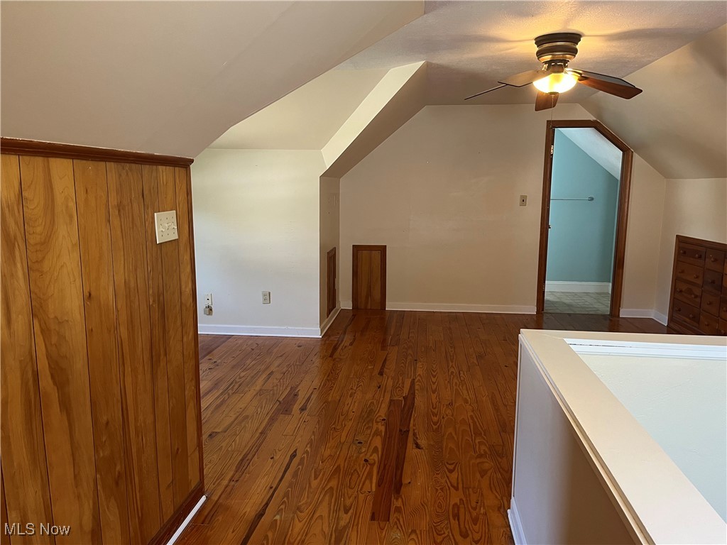29946 Enid Road Wickliffe, OH 44092 - Photo 32 of 50 Upstairs dormer bedroom with lofted ceiling, TWO ceiling fans, built-in drawers and shelves, and hardwood floors