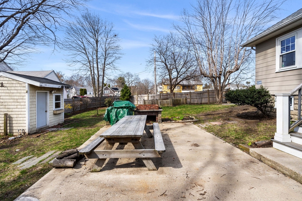 109 Linden Road Melrose, MA 02176 - Photo 15 of 15 a view of a patio with a table chairs and a yard