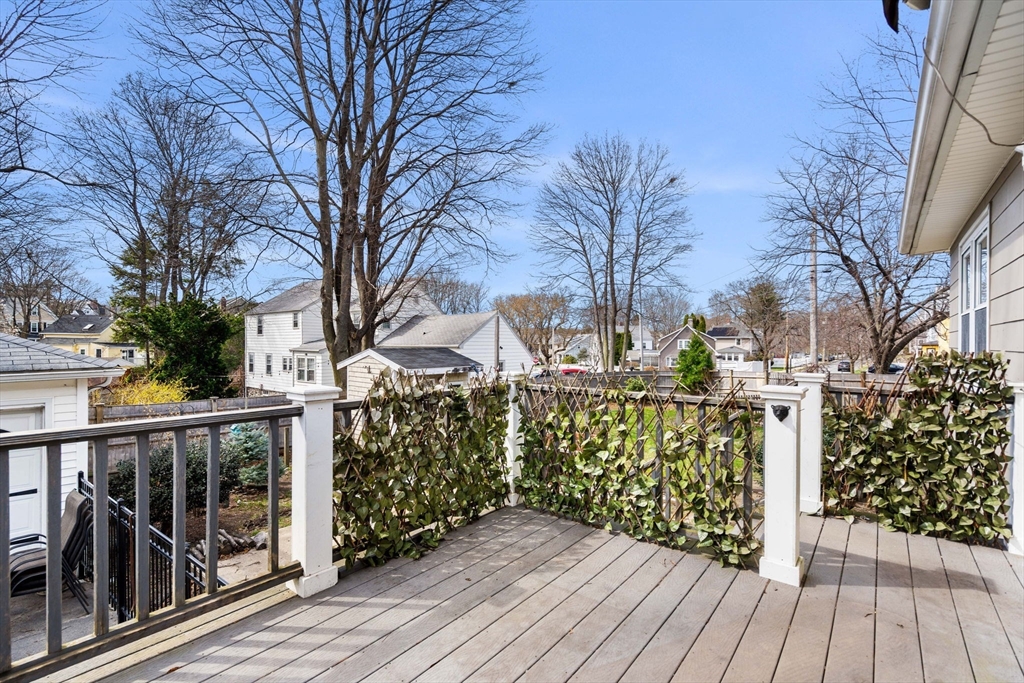 109 Linden Road Melrose, MA 02176 - Photo 4 of 15 a view of a pathway of a house with a wooden bench next to a yard