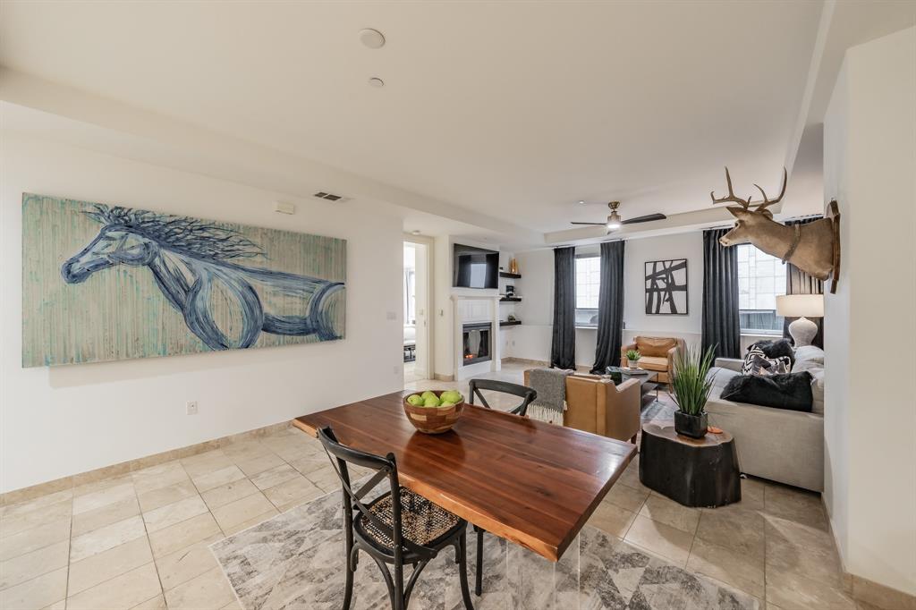 1505 Elm Street, Unit 404 Dallas, TX 75201 - Photo 12 of 40 a living room with furniture and wooden floor