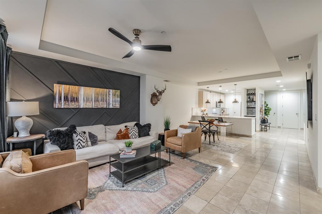 1505 Elm Street, Unit 404 Dallas, TX 75201 - Photo 14 of 40 a living room with furniture and a large window