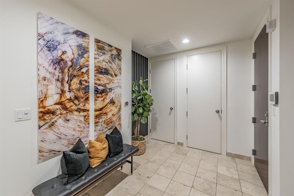 1505 Elm Street, Unit 404 Dallas, TX 75201 - Photo 2 of 40 a view of an empty room and entryway