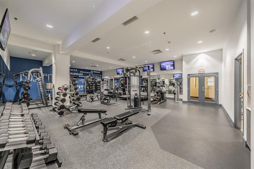 1505 Elm Street, Unit 404 Dallas, TX 75201 - Photo 23 of 40 a view of a room with gym equipment