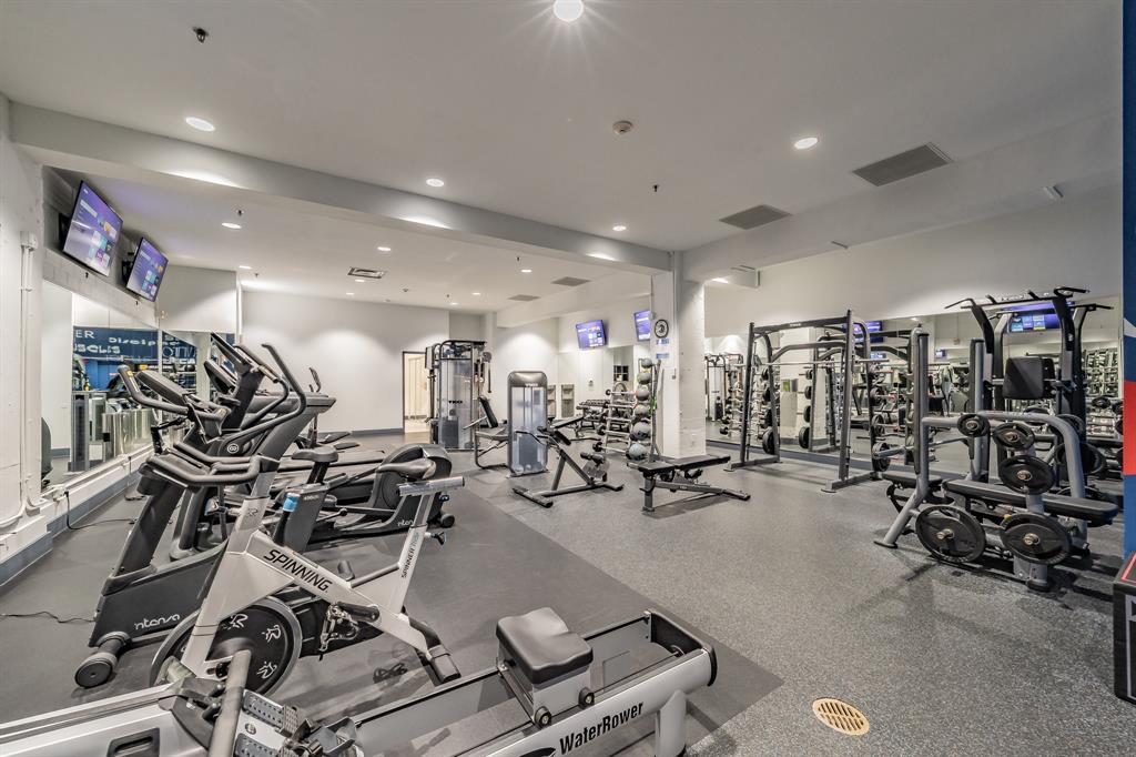 1505 Elm Street, Unit 404 Dallas, TX 75201 - Photo 24 of 40 a view of a room with gym equipment