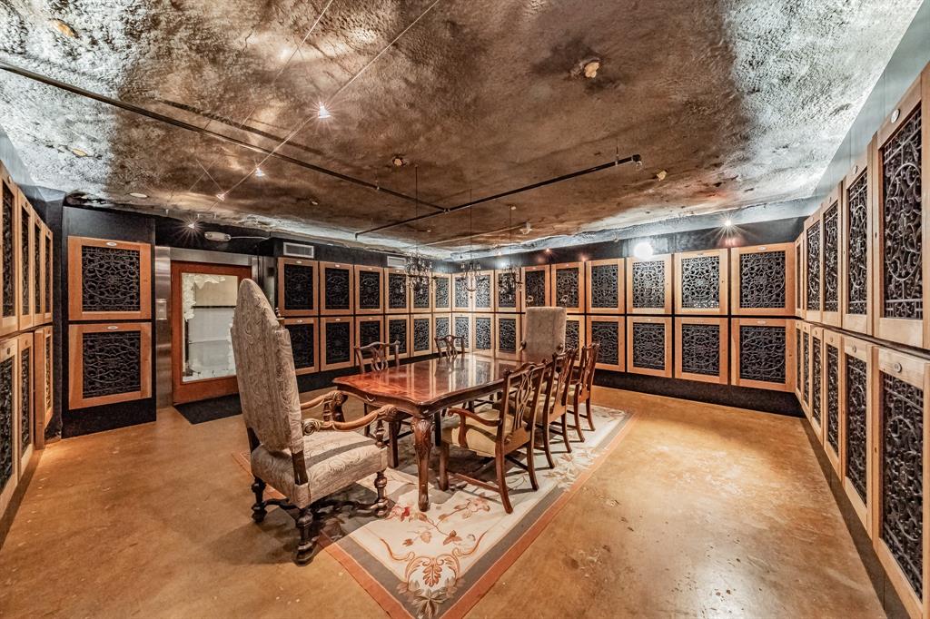 1505 Elm Street, Unit 404 Dallas, TX 75201 - Photo 28 of 40 a view of a hallway with wooden stairs
