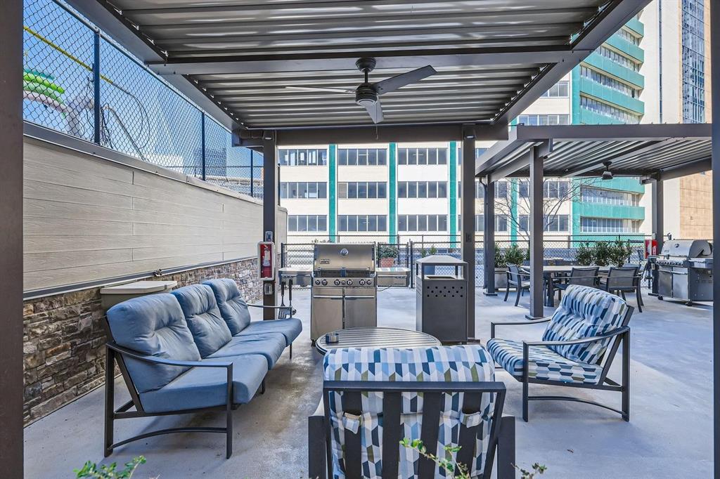 1505 Elm Street, Unit 404 Dallas, TX 75201 - Photo 36 of 40 a outdoor space with patio the couches and chairs
