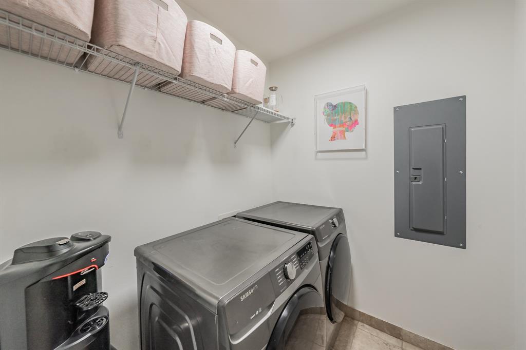 1505 Elm Street, Unit 404 Dallas, TX 75201 - Photo 10 of 40 a utility room with dryer and washer