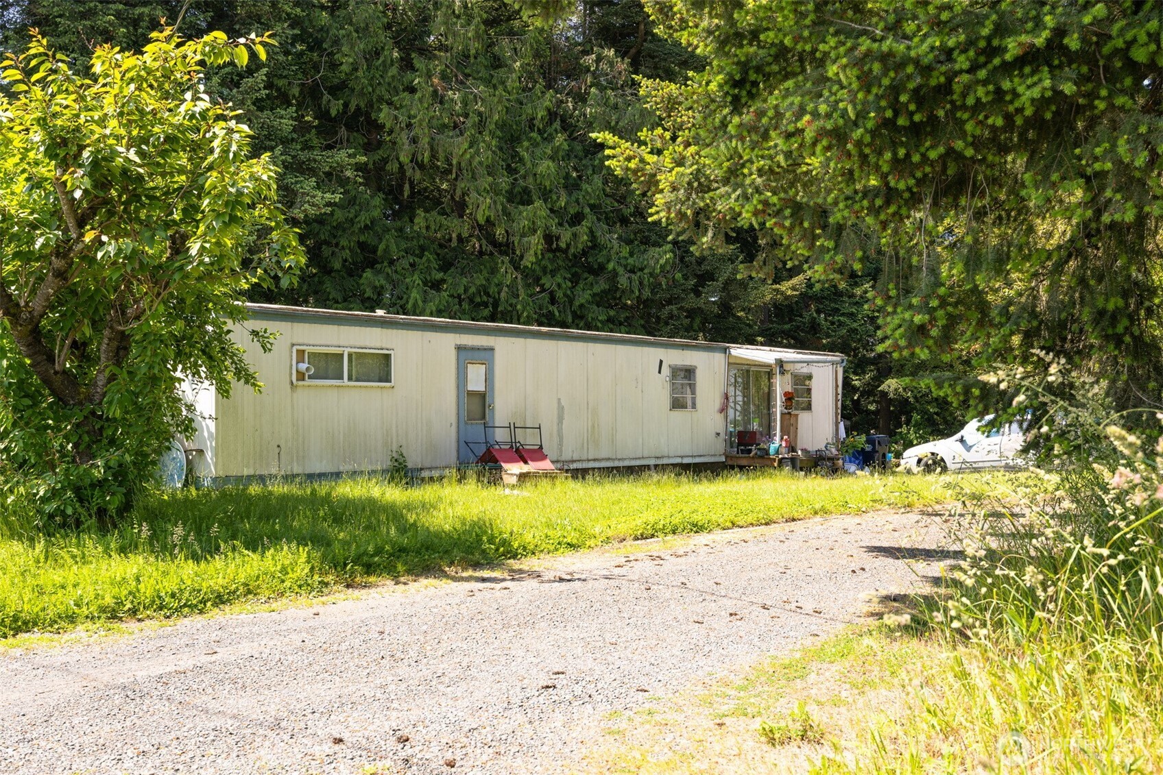 6791 Noon Road Everson, WA 98247 - Photo 34 of 38 a front view of house with yard and trees in the background