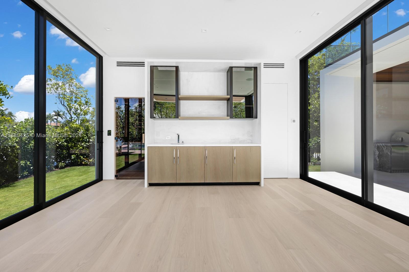 2700 Sunset Drive Miami Beach, FL 33140 - Photo 12 of 40 a bed sitting in a spacious bedroom next to a window