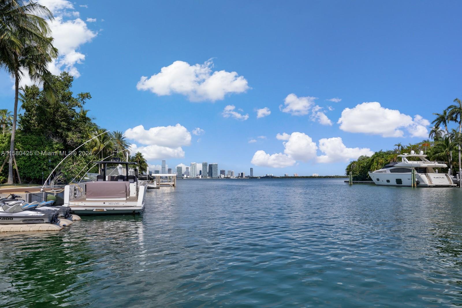 2700 Sunset Drive Miami Beach, FL 33140 - Photo 15 of 40 a view of a lake with couches and wooden floor