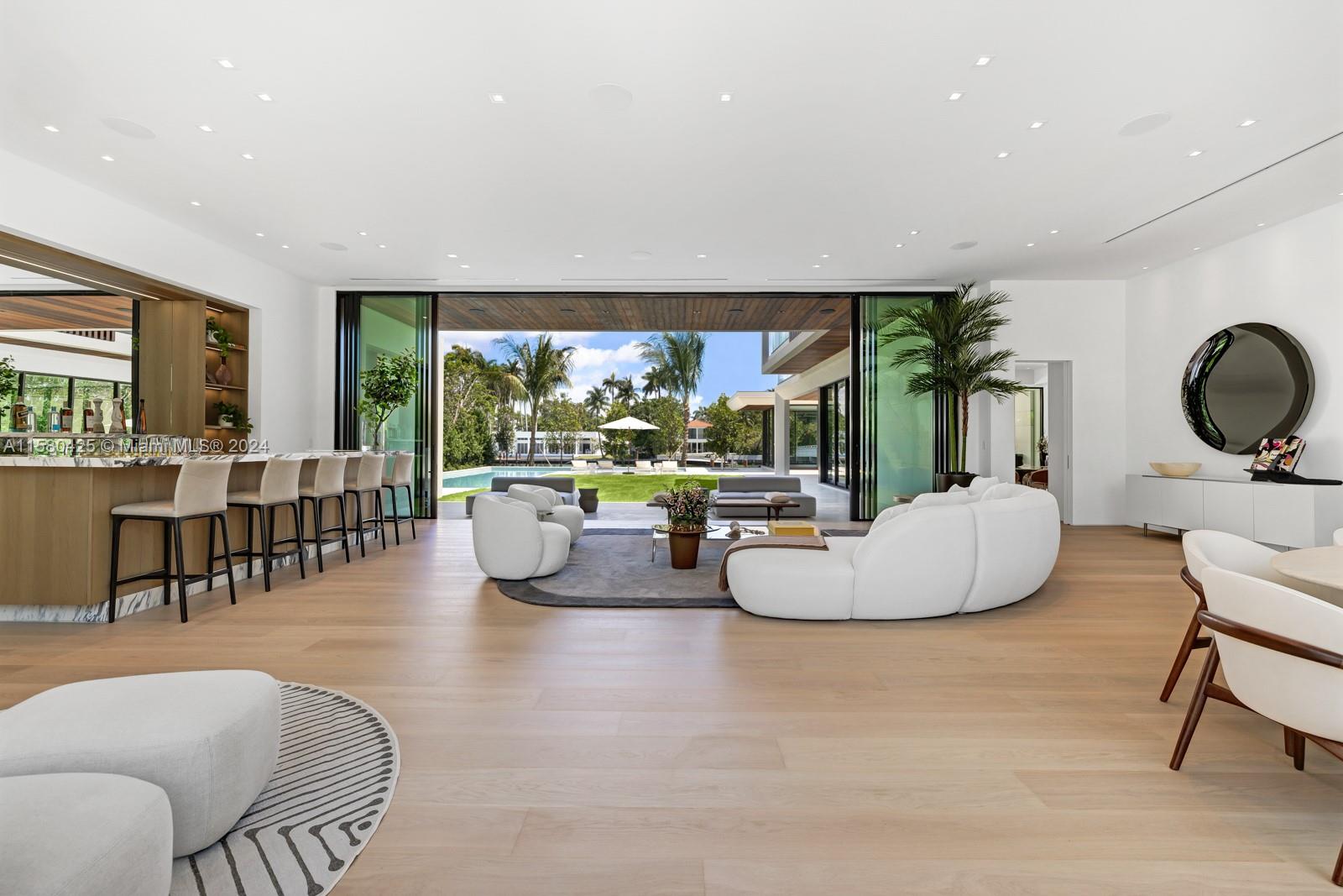2700 Sunset Drive Miami Beach, FL 33140 - Photo 18 of 40 a living room with furniture a rug and a large window