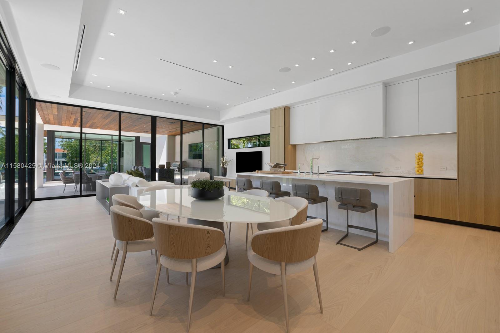 2700 Sunset Drive Miami Beach, FL 33140 - Photo 24 of 40 a view of a dining room with furniture window and outside view