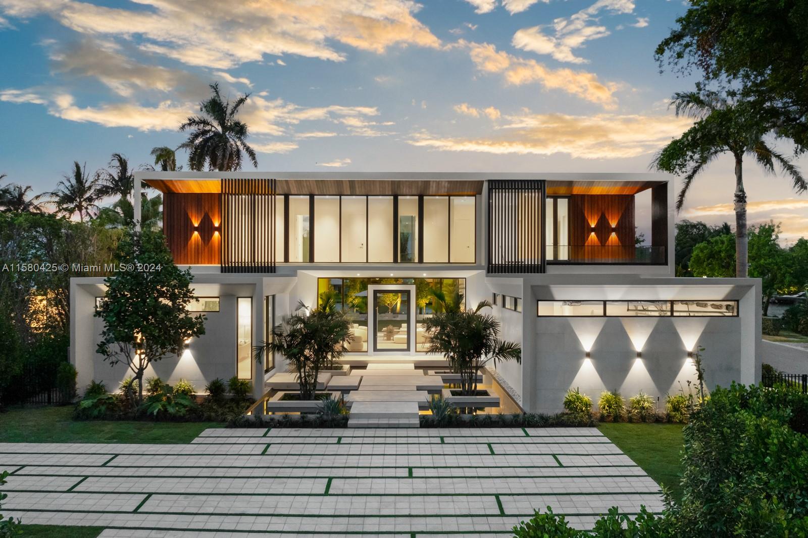 2700 Sunset Drive Miami Beach, FL 33140 - Photo 35 of 40 a front view of a house with garden