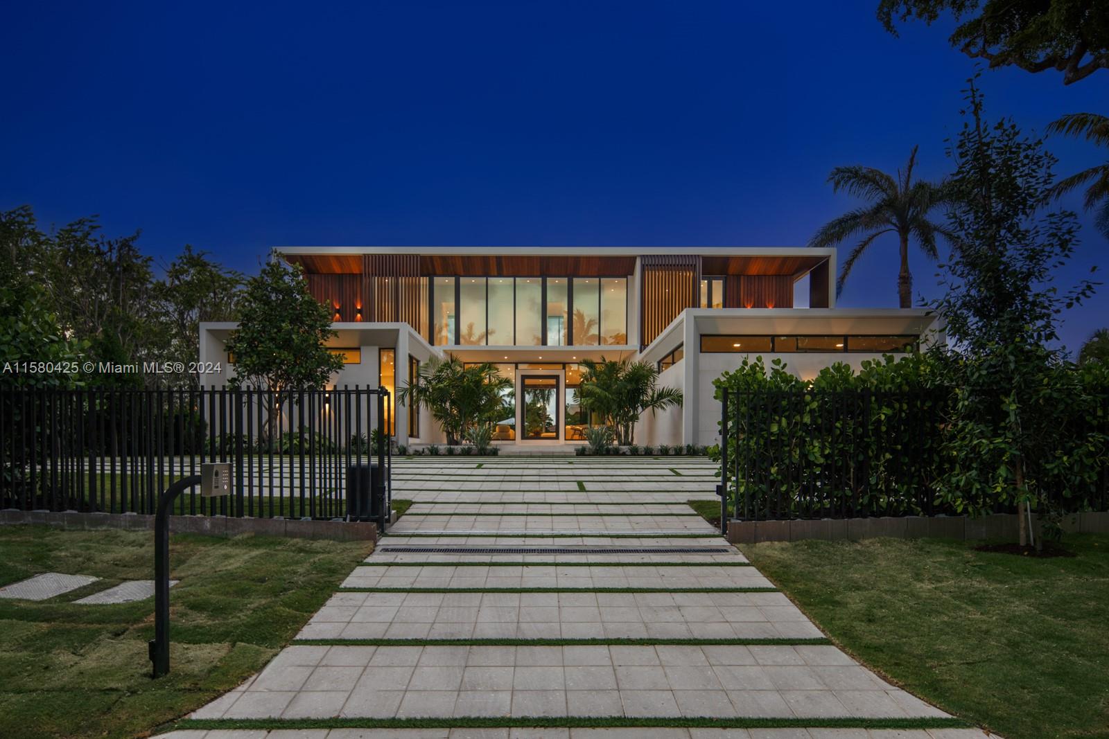 2700 Sunset Drive Miami Beach, FL 33140 - Photo 36 of 40 a front view of a house with a yard