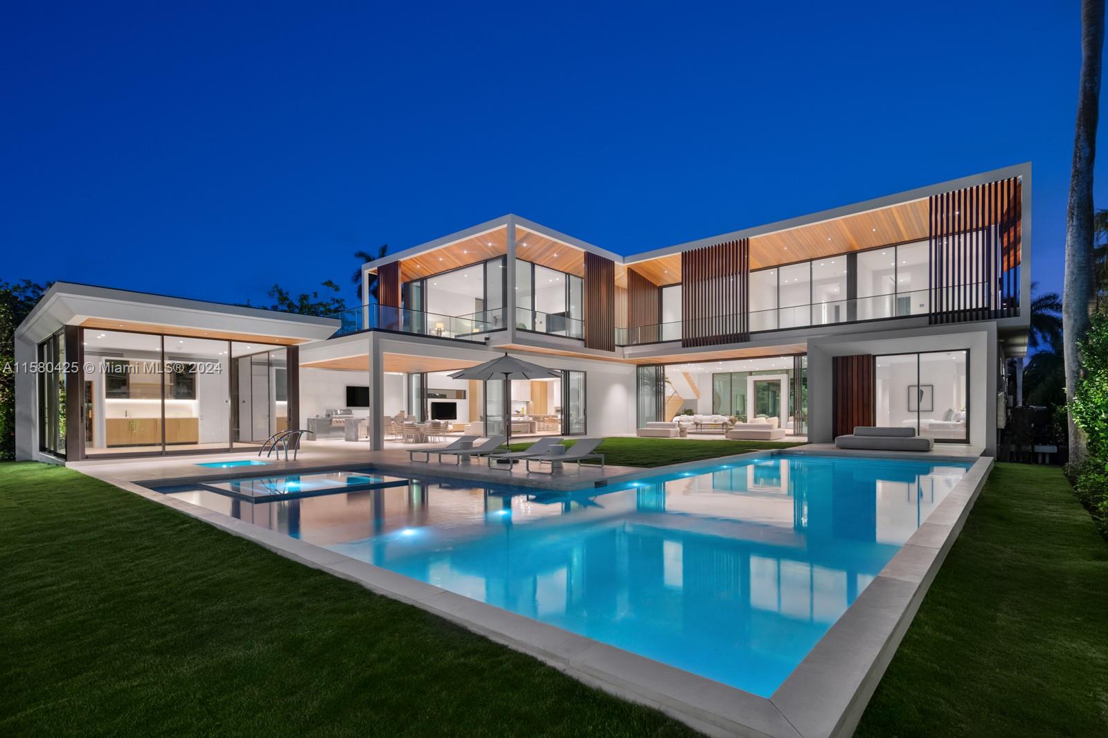 2700 Sunset Drive Miami Beach, FL 33140 - Photo 40 of 40 a front view of a house with swimming pool having outdoor seating