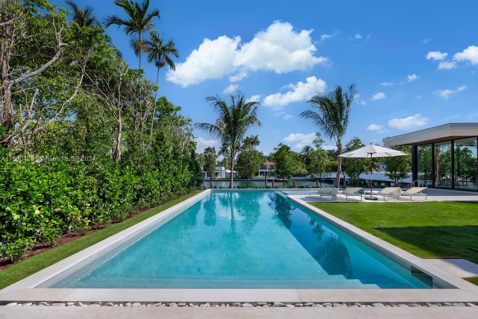 2700 Sunset Drive Miami Beach, FL 33140 - Photo 5 of 40 a view of a swimming pool with outdoor seating