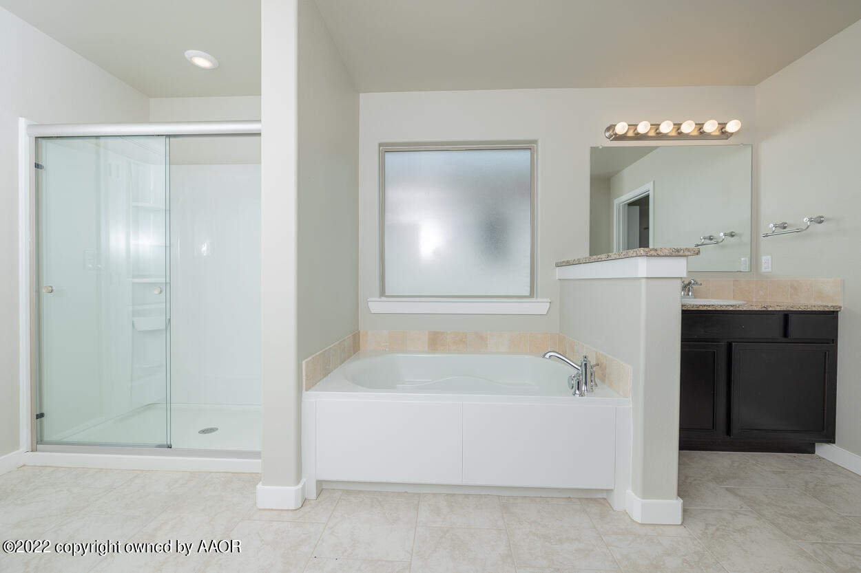 2600 Daybreak Lane Amarillo, TX 79124 - Photo 20 of 36 a bathroom with a bathtub and a sink